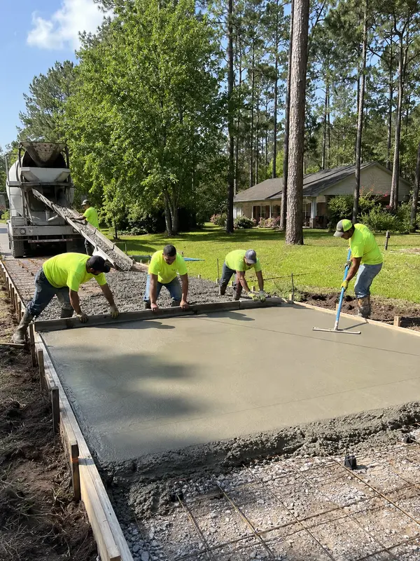 Crew Performing Concrete Street New Construction Commercial concrete paving project by Chris Paving LLC